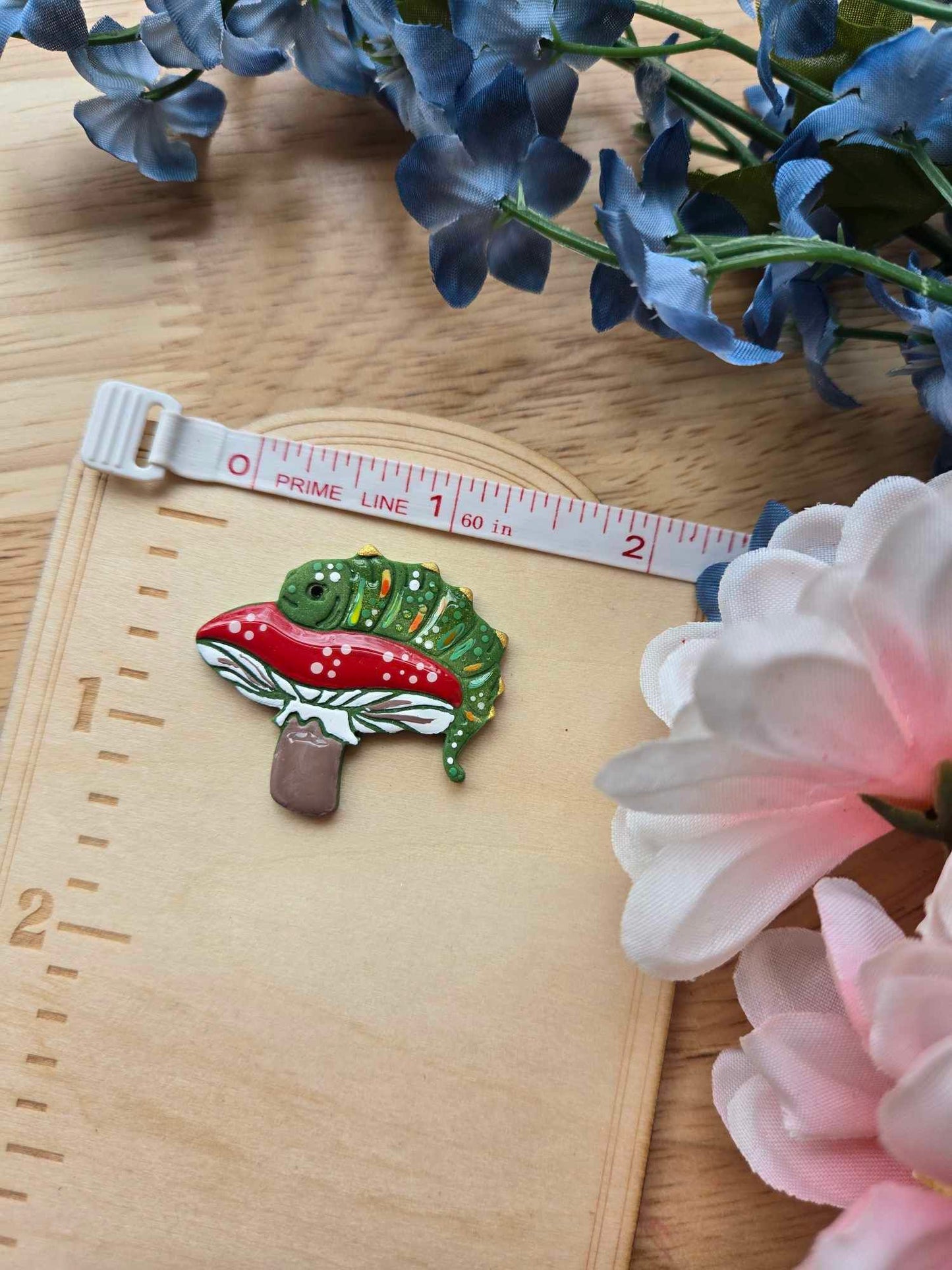 The Caterpillar Needle Minder