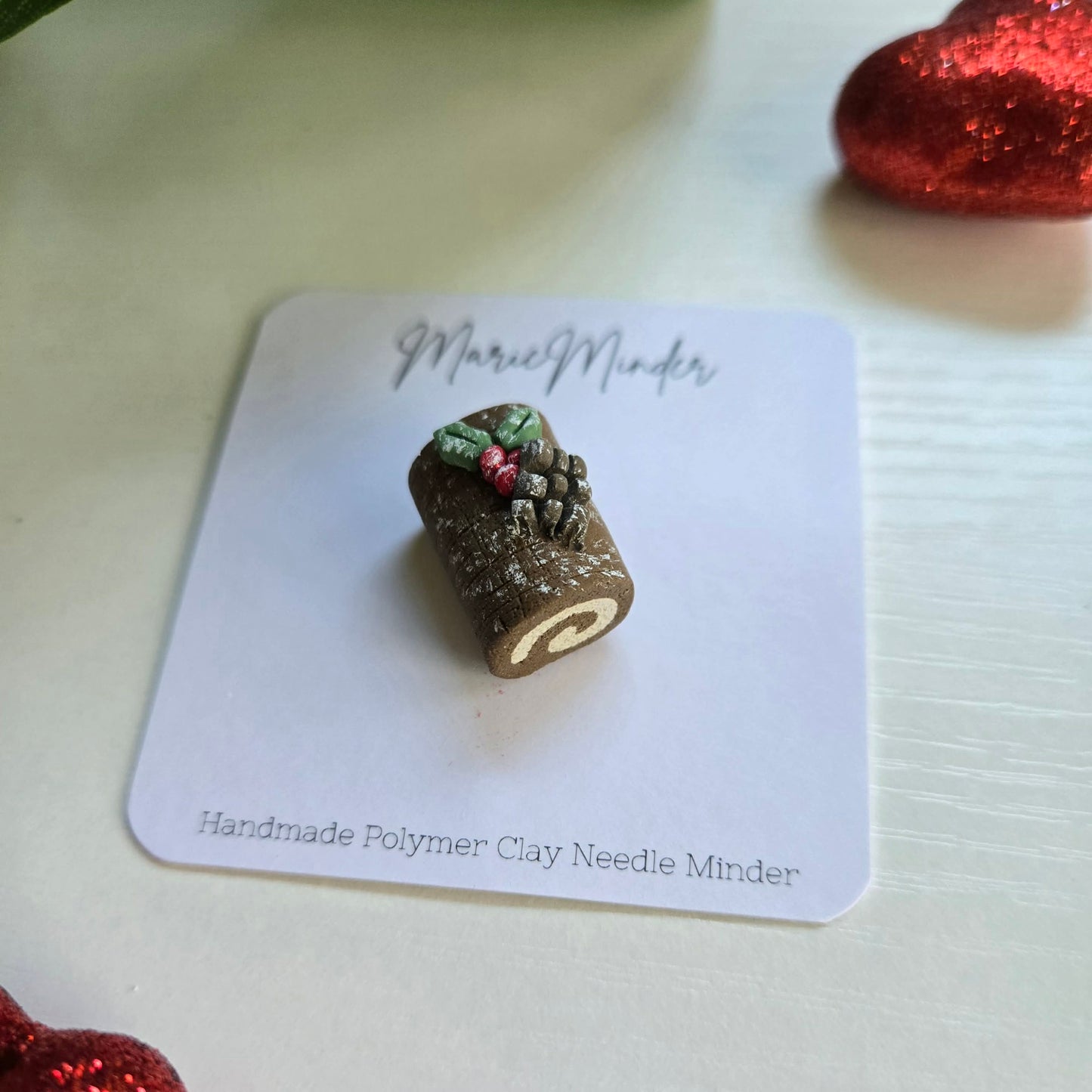 Log Cake Needle Minder
